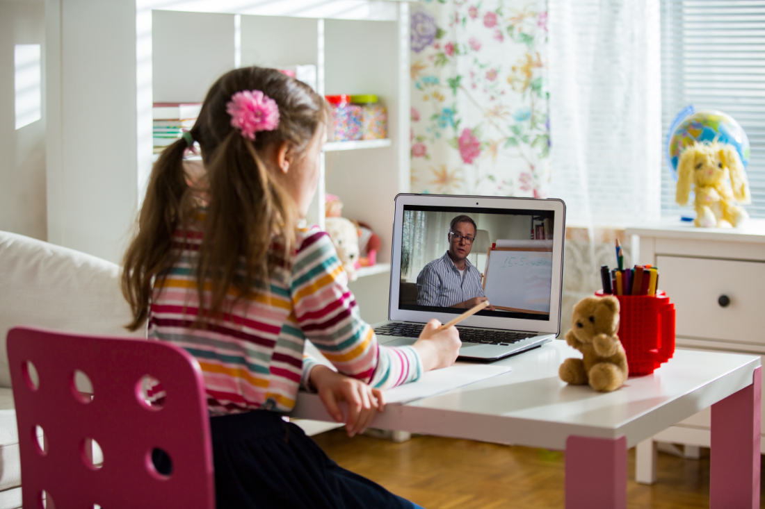 Middle-aged distance teacher having video conference call with p